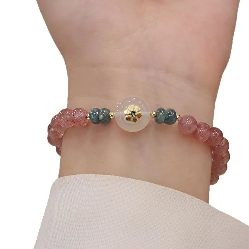 Women's strawberry quartz and blue water emerald bracelet with round jade pendant and geometric design