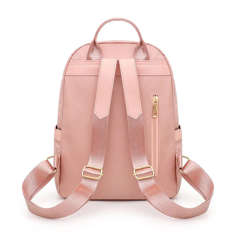Men's black casual nylon backpack with shoulder straps, showing outer pocket and square vertical shape.