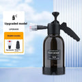 Black hand-held foam sprayer with a 2-litre capacity bottle and pump mechanism.