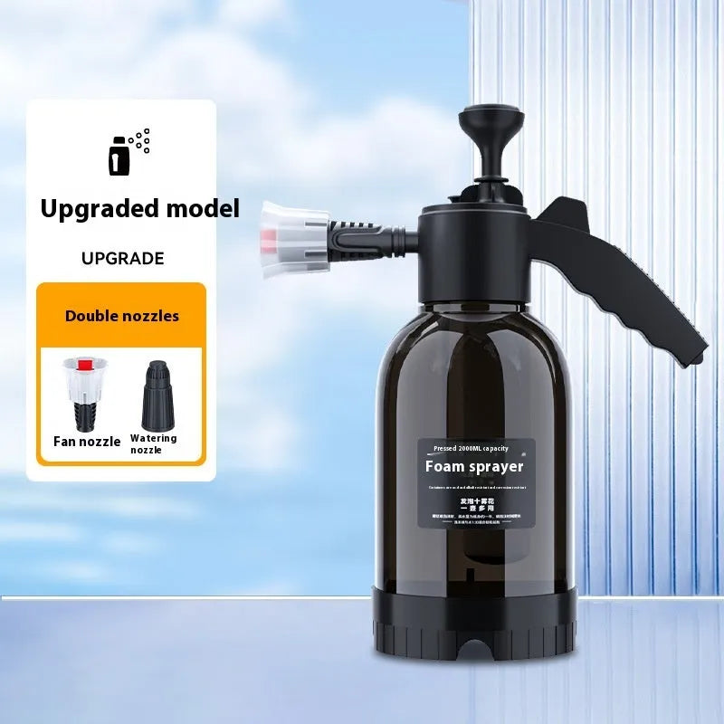 Black hand-held foam sprayer with a 2-litre capacity bottle and pump mechanism.