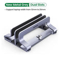 Silver aluminium alloy adjustable computer bracket clamped to a desk edge.