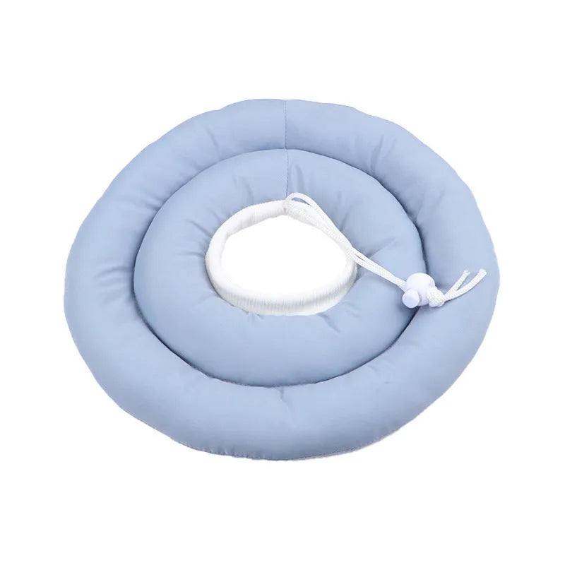 Blue adjustable Elizabethan recovery collar for a dog or cat on a white background.