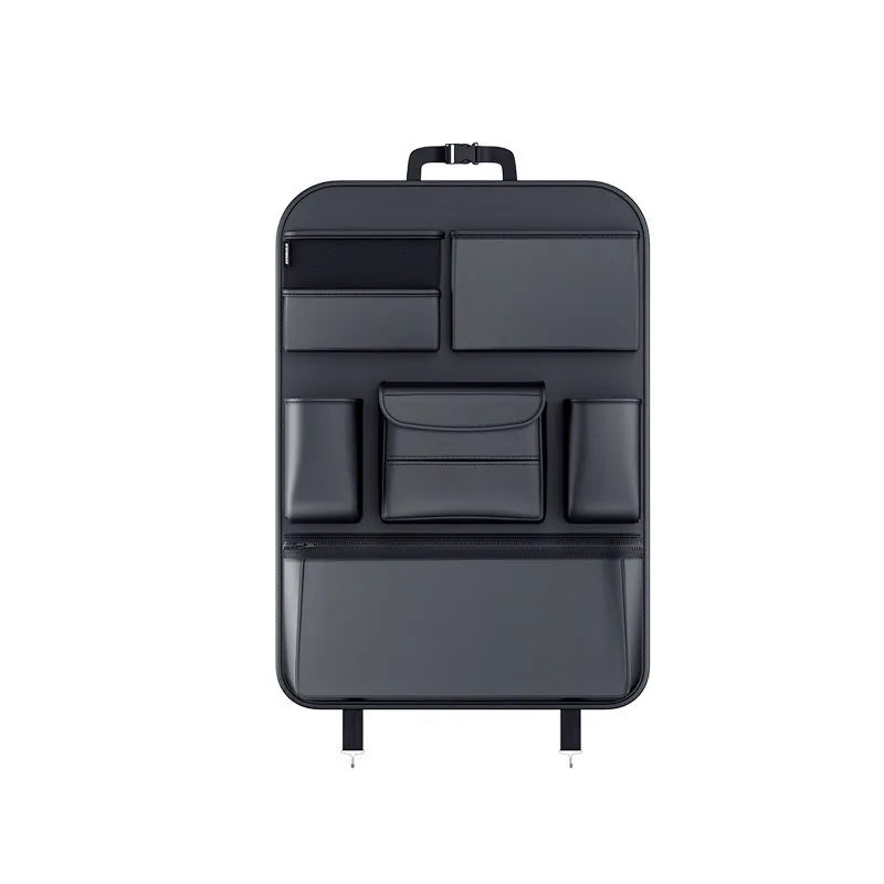 Black leather car seat back storage hanging bag with handle shown behind vehicle seat