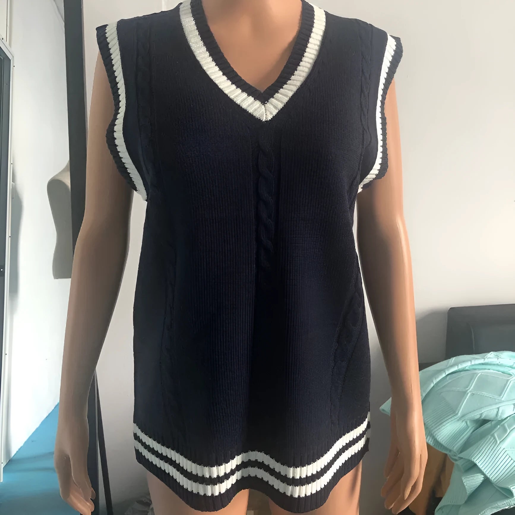 Women's black knitted V-neck waistcoat sweater with striped stitching detail