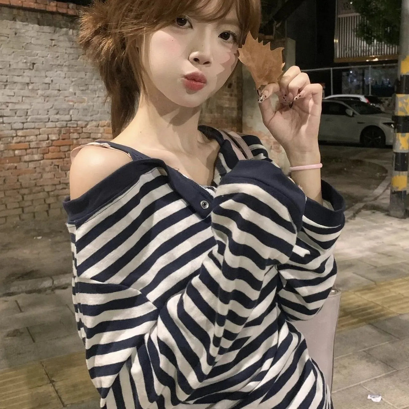 Dark blue women's long-sleeved oversized T-shirt with Korean style embroidery and stripe details.