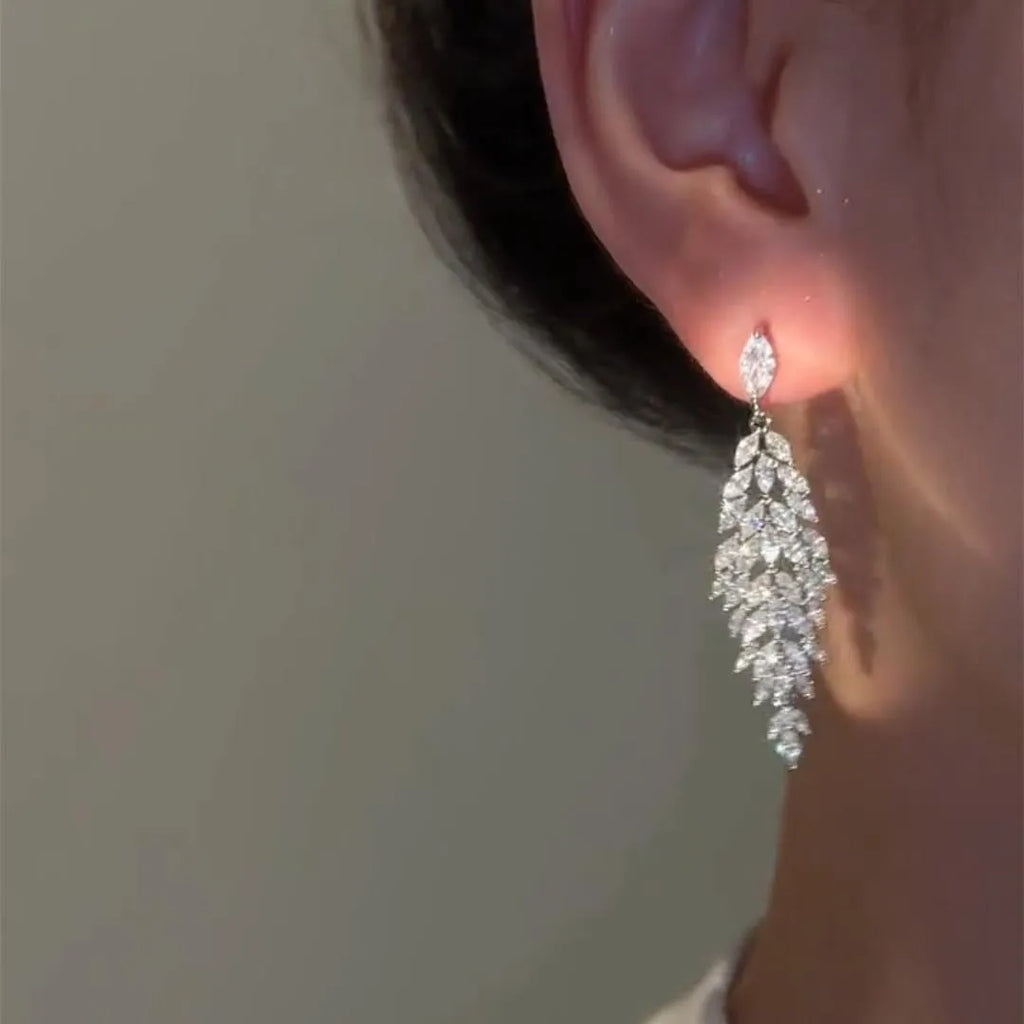 Silver anti-allergy auricular needle earrings with Japanese Korean style New Year design on alloy base