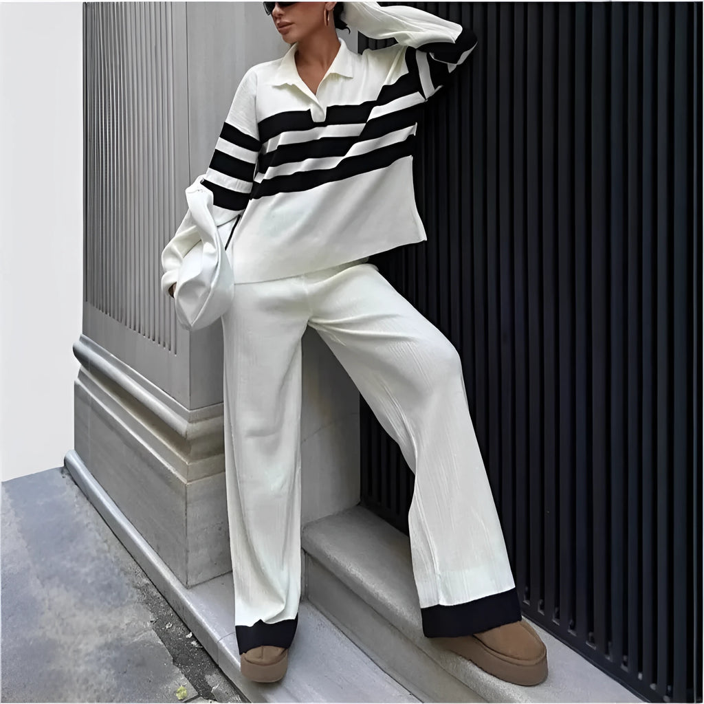 Women's black and white striped knitted two-piece set with a polo collar, featuring a long-sleeve top and trousers.