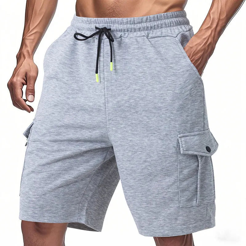Men's loose grey cargo shorts with multiple pockets, made from textured terry fabric.