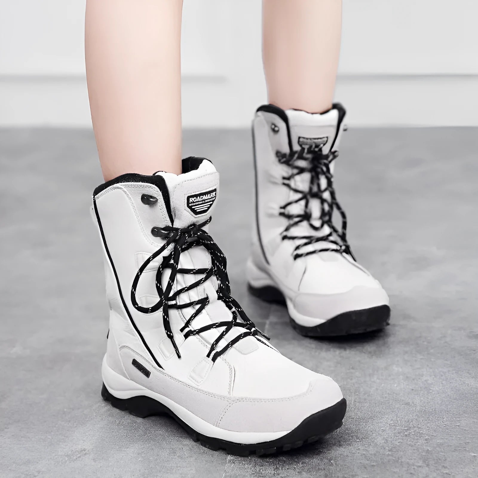 Women's black waterproof thermal snow boots with genuine leather uppers and rubber soles