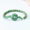 Emerald green jade bracelet with peace buckle clasp and star design elements
