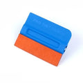 Car film application scraper tool with magnetic head and ABS handle on a work surface.