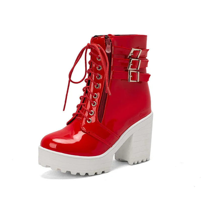 Women's black thick heel ankle boots with round toe and front lace-up on a waterproof platform.