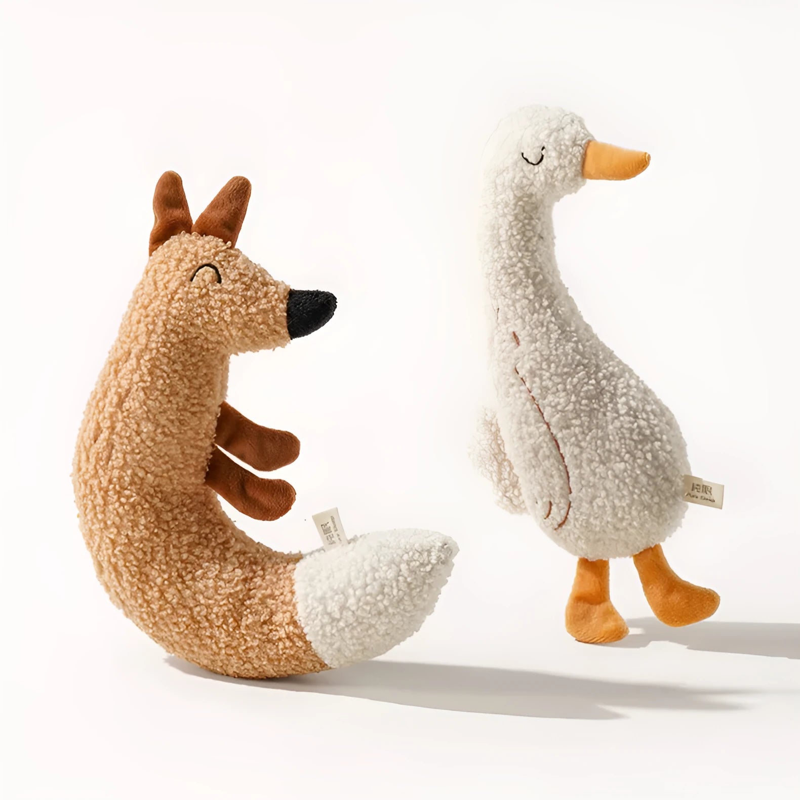 Cartoon fox and duckling design chew-resistant dog toys made from teddy velvet fabric.