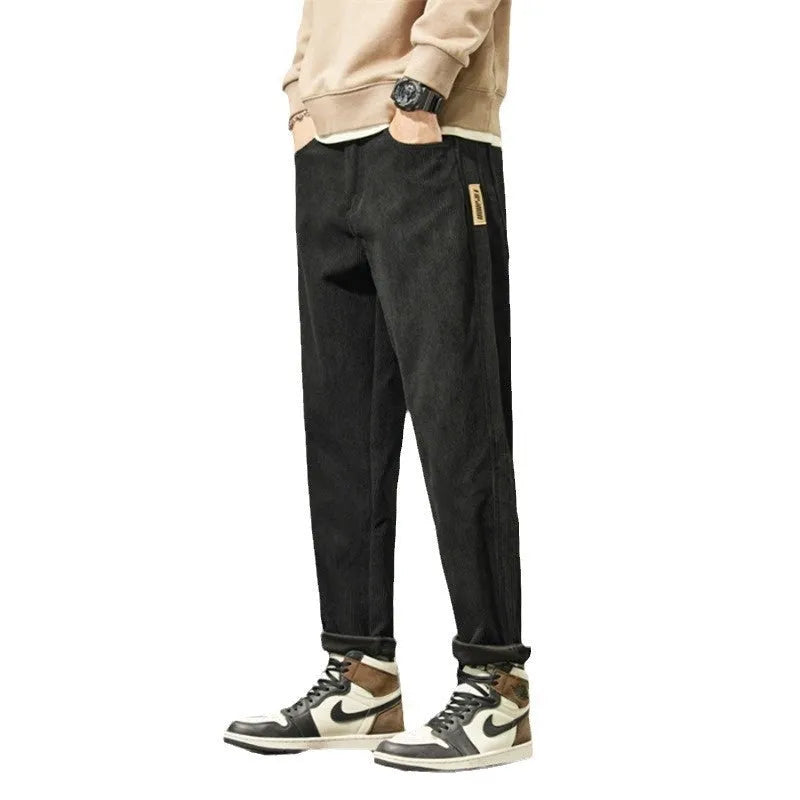 Men's army green corduroy casual trousers with a tapered straight-leg fit on a mid waist.
