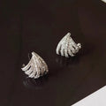 A pair of women's geometric line design earrings in platinum-finished zircon.