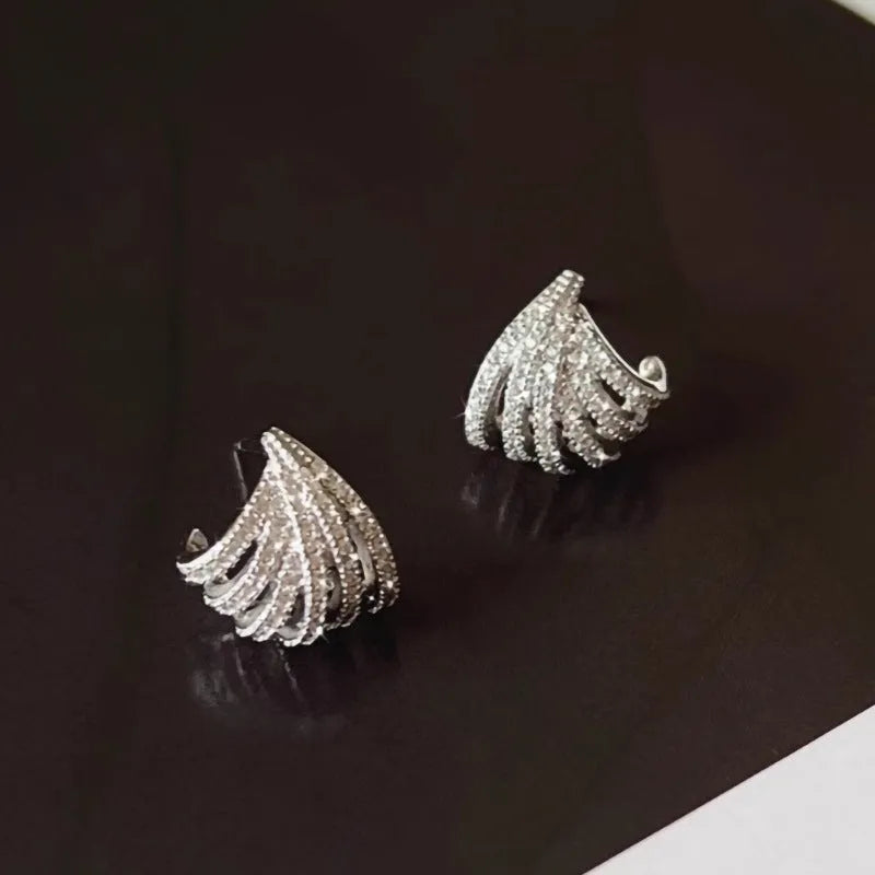 A pair of women's geometric line design earrings in platinum-finished zircon.