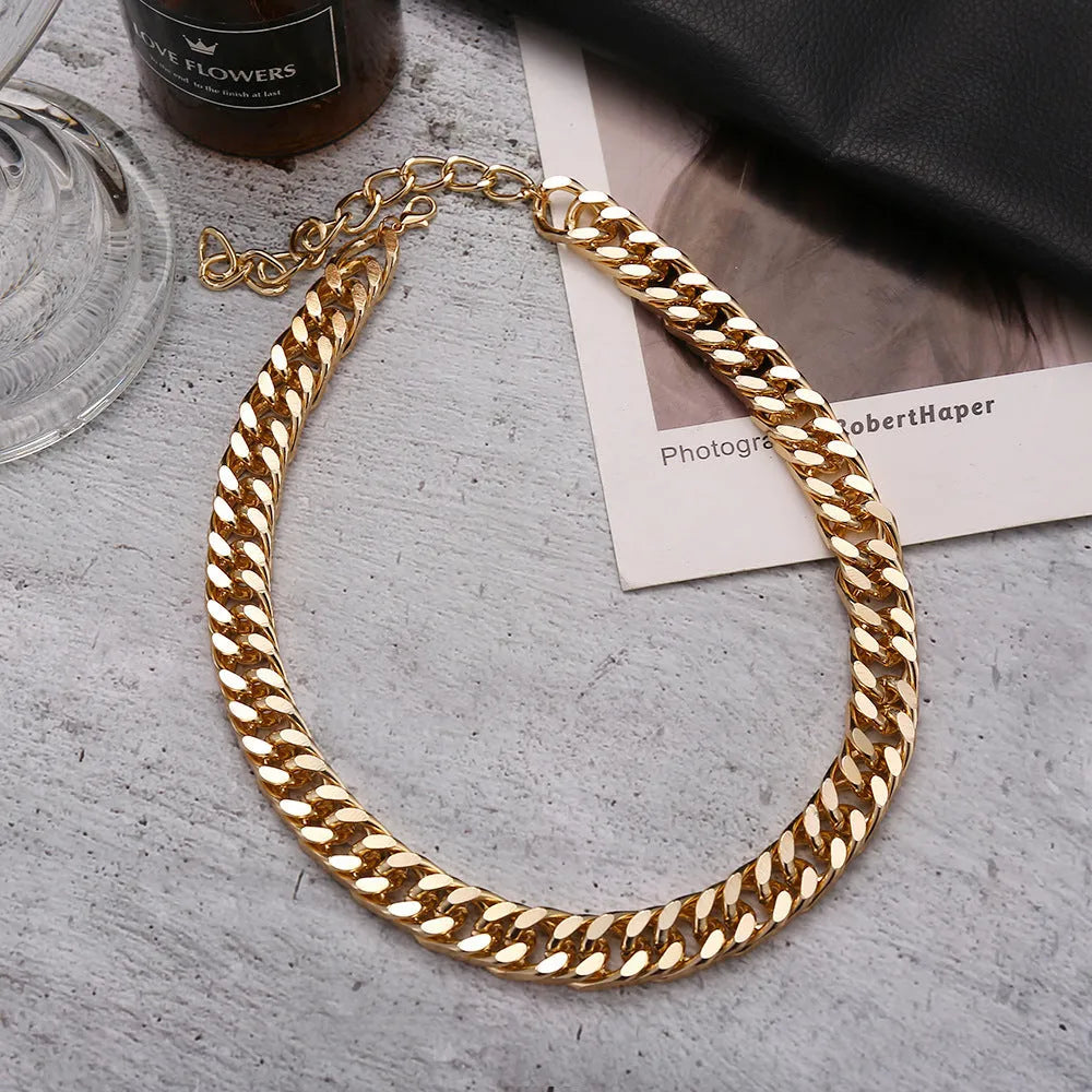 Gold thick chain necklace for women with a simple solid colour design.