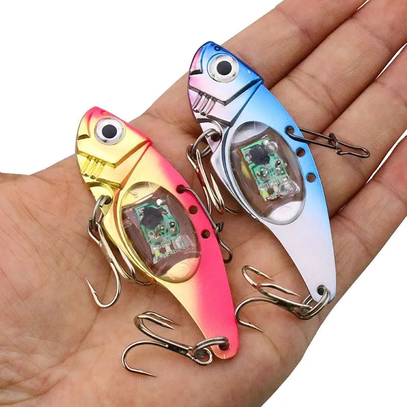 Electronic fishing lure with luminous metal vib body in blue and red colour options
