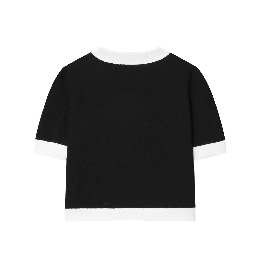 Women's beaded round-neck top and high-waisted trousers co-ord set in a contrast colour.