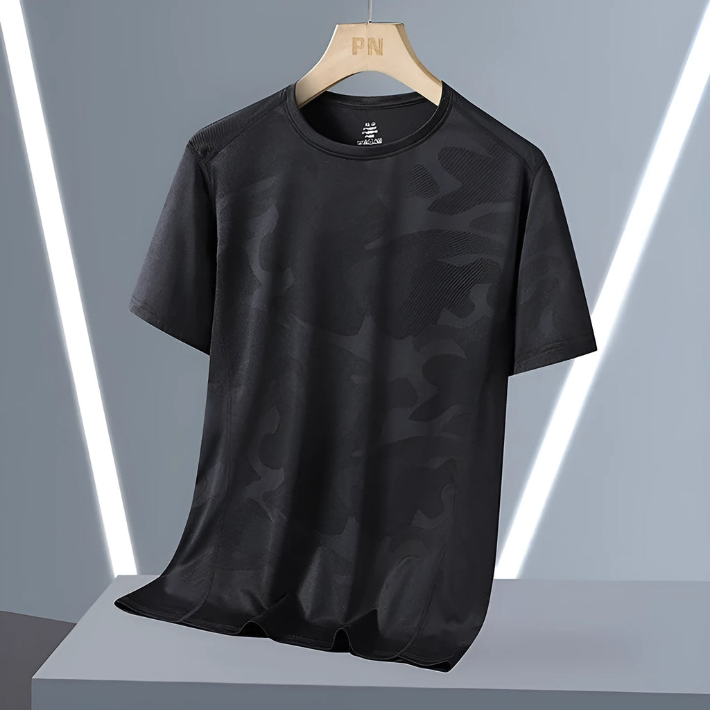 Plus size men's camouflage print short sleeve top in nylon fabric on a hanger.