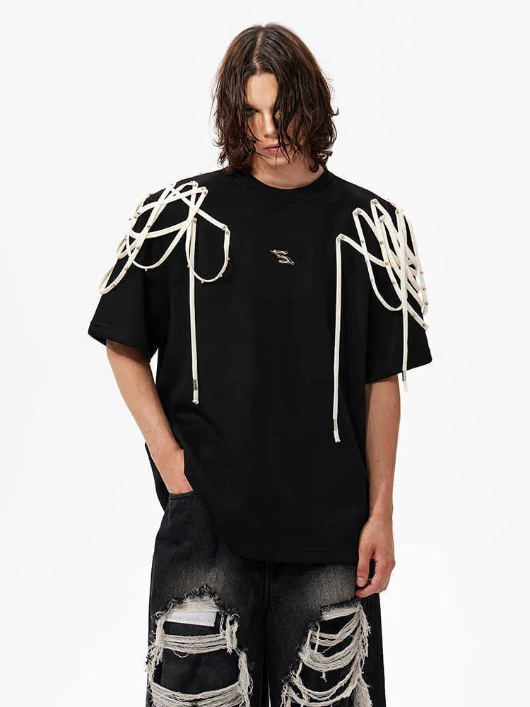 Black short-sleeved T-shirt with padded shoulders and rivet ribbon detail, loose fit with round neck
