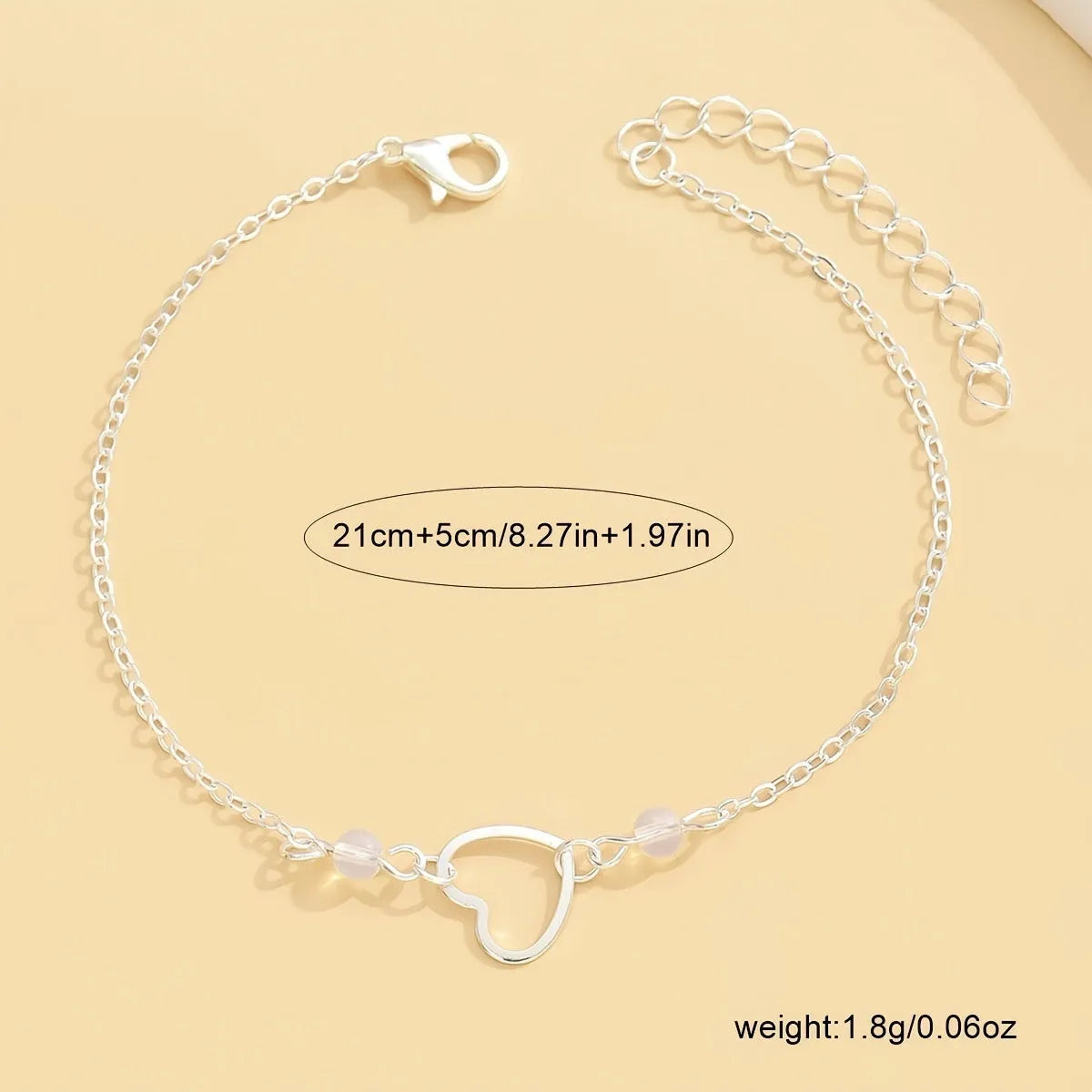 Adjustable women's anklet with heart pendant in gold or silver alloy