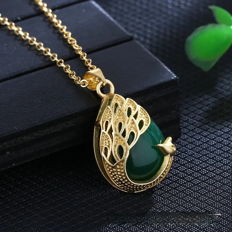 Green chalcedony imitation crystal peacock pendant on copper electroplated frame, single pendant style without chain, simple fu character design