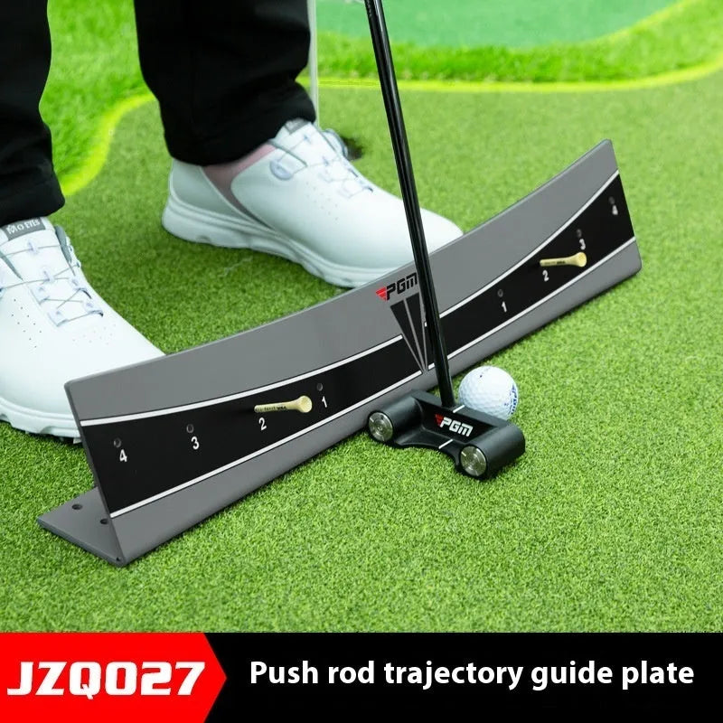 Close-up of an adjustable PVC golf putter trajectory balance simulator on a flat surface.