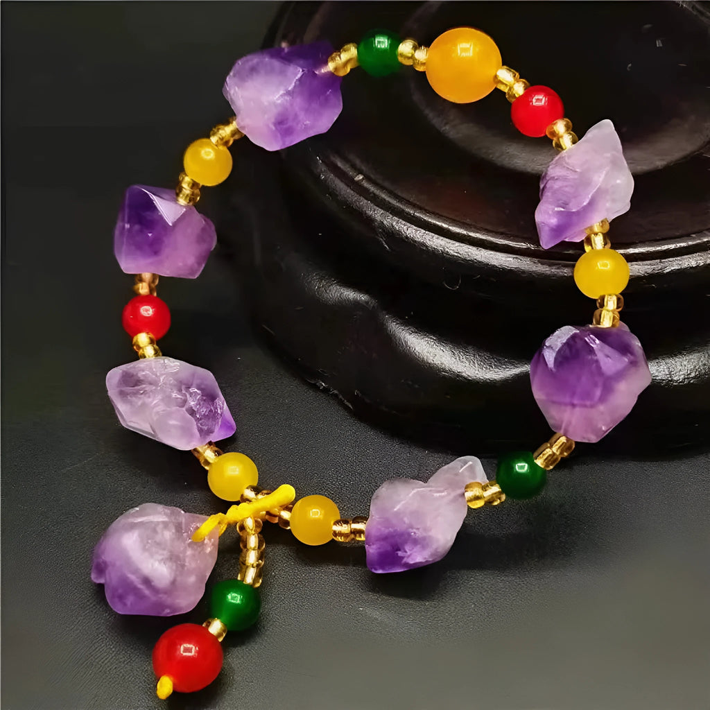 Natural shaped purple amethyst bead bracelet with a fu character charm for women.