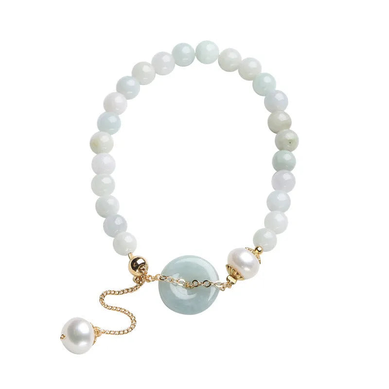 Natural emerald jade pearl bracelet with peace symbol buckle showing geometric charm arrangement