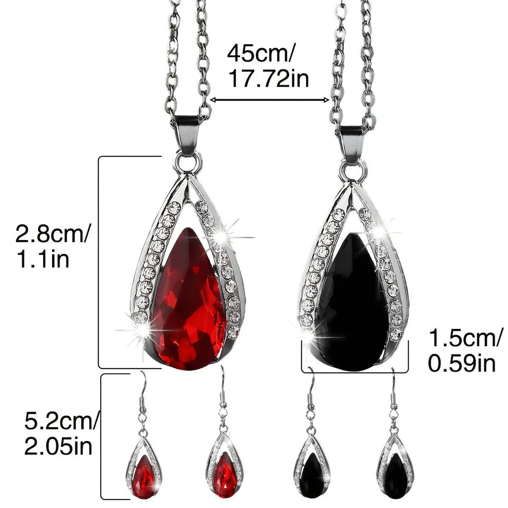 Black and red teardrop glass pendant necklace and matching earrings set on display.