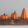 Three Halloween pumpkin lanterns in short, medium, and long sizes with LED illumination and realistic surface cracks