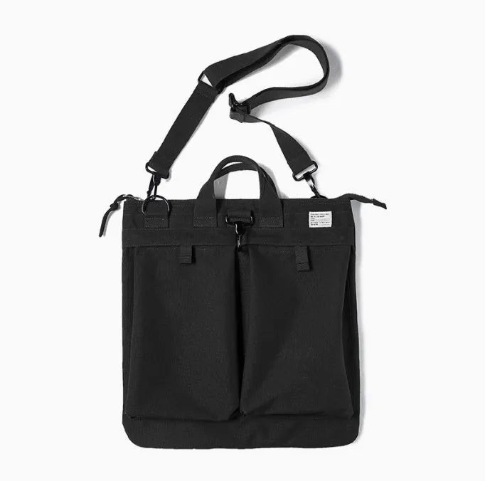 Marden canvas crossbody messenger bag in military green showing laptop compartment and shoulder strap