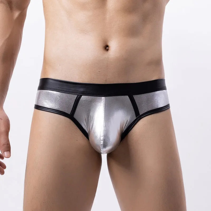 Gold metallic men's swim briefs with low waist and body-shaping design on a mannequin.