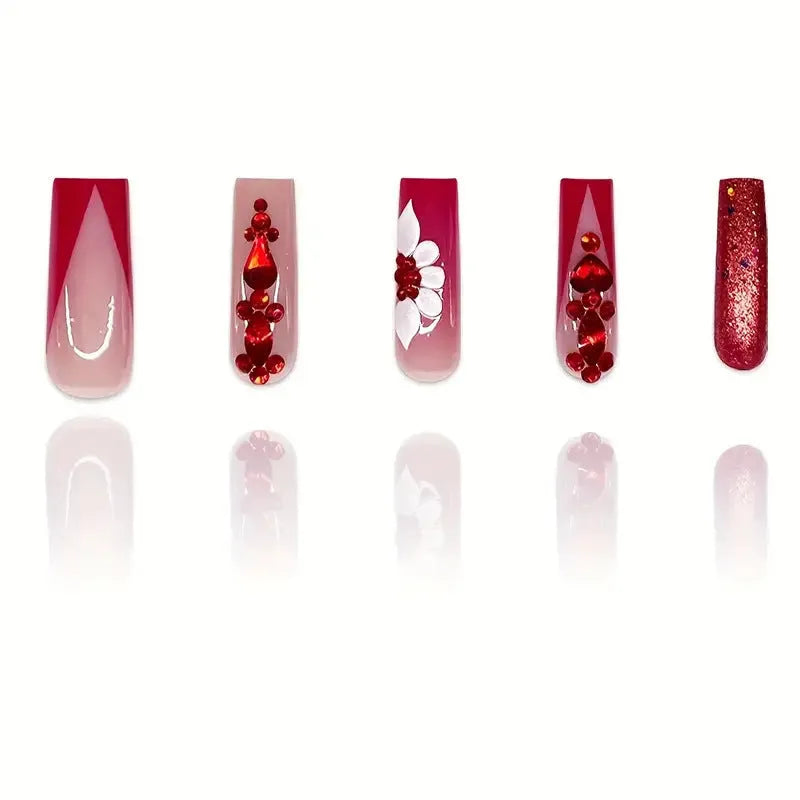 Sweet Flowers patterned fake nails with red diamonds in a long European square style.