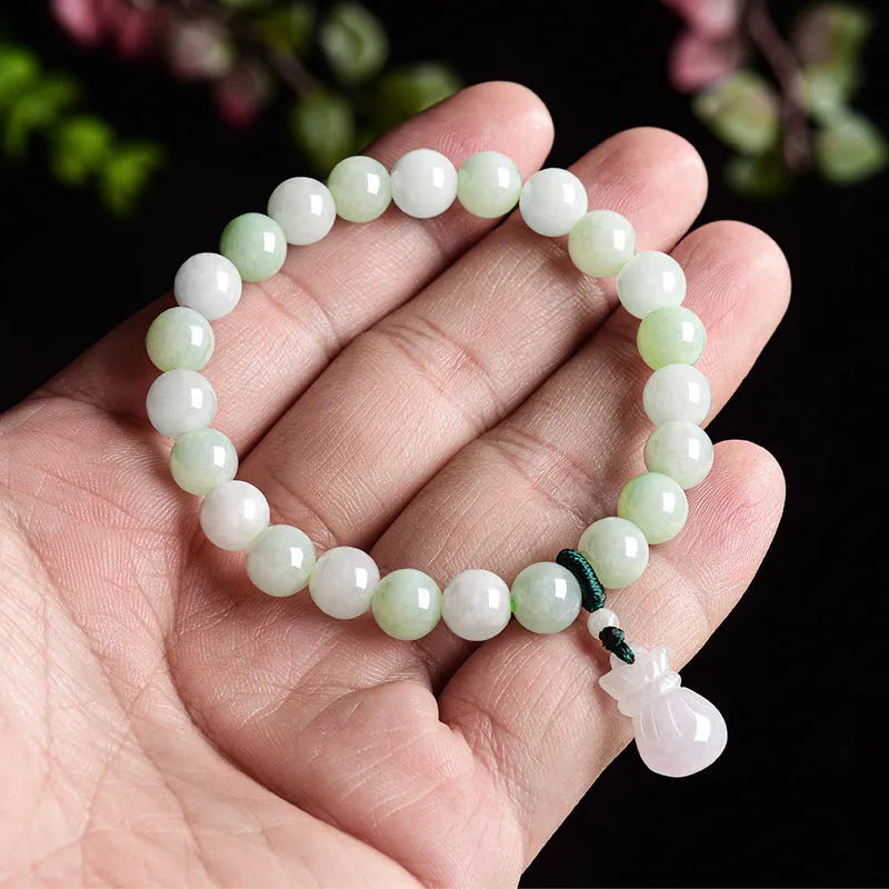 Jade flower bracelet with 8mm diameter floral centrepiece and adjustable unisex fastening