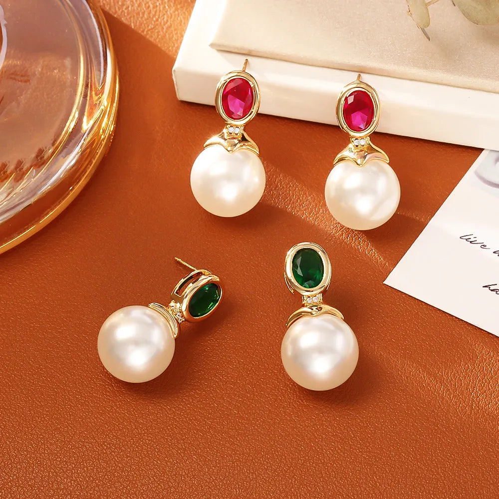 High-grade ruby pearl stud earrings with real gold plating on copper, round geometric shape, available in red or green