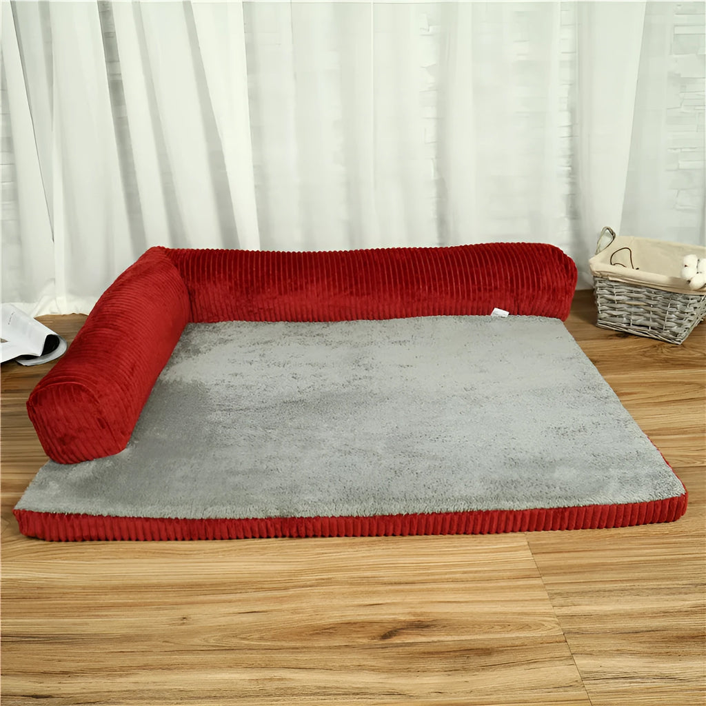 Corduroy bolster dog bed in grey with a removable cover, shown in a large (L) size on a hardwood floor.
