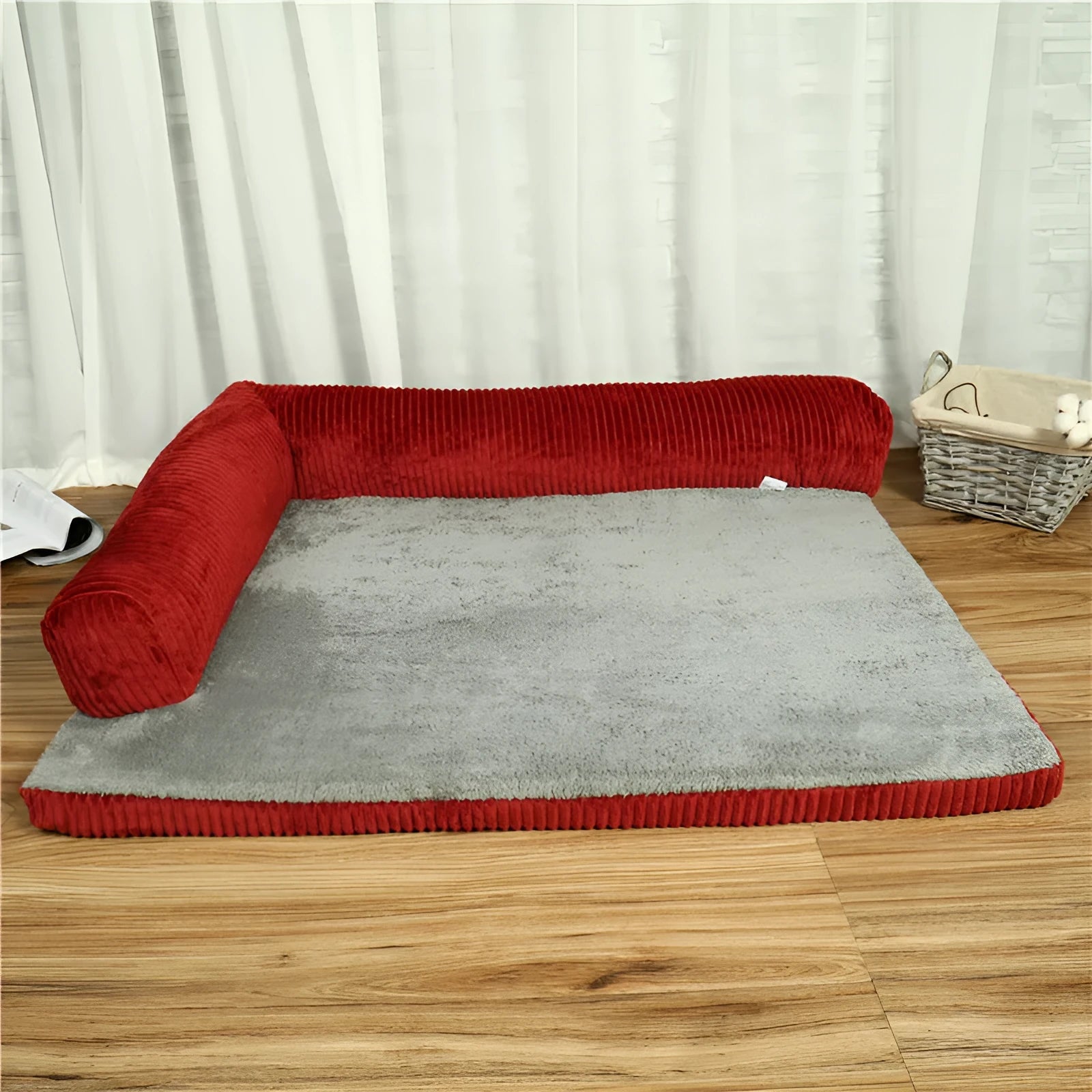 Corduroy bolster dog bed in grey with a removable cover, shown in a large (L) size on a hardwood floor.