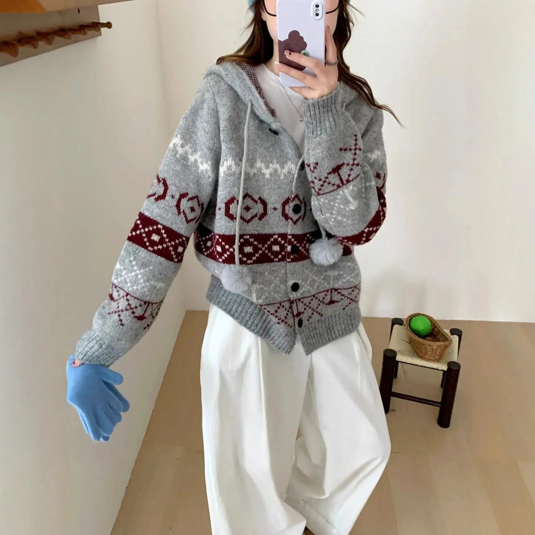 Loose grey brocade sweater coat with geometric pattern on a plus-size model.
