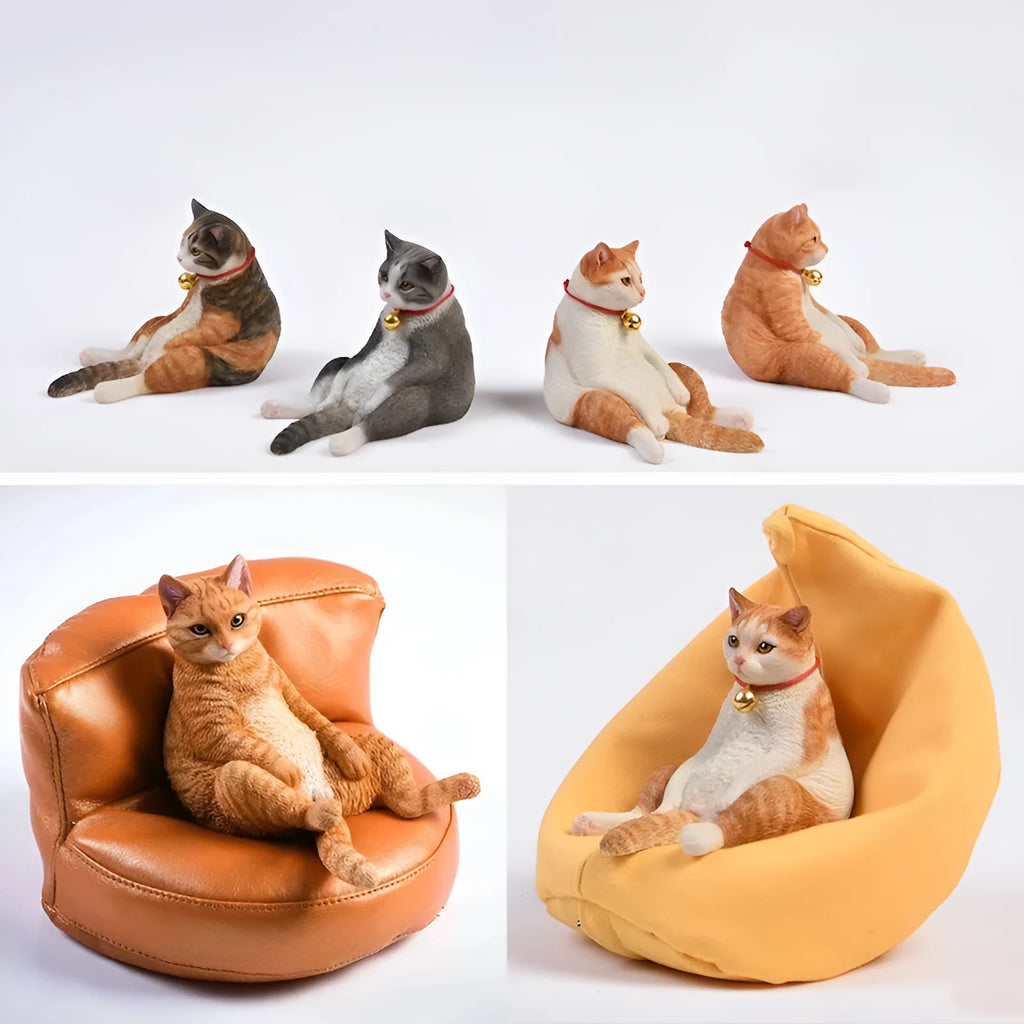 Small 7.5cm high cat model car ornament with fabric sofa on a dashboard.