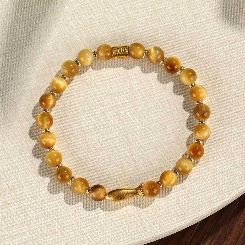 Handmade yellow tiger eye bracelet with small fish charm bead for women