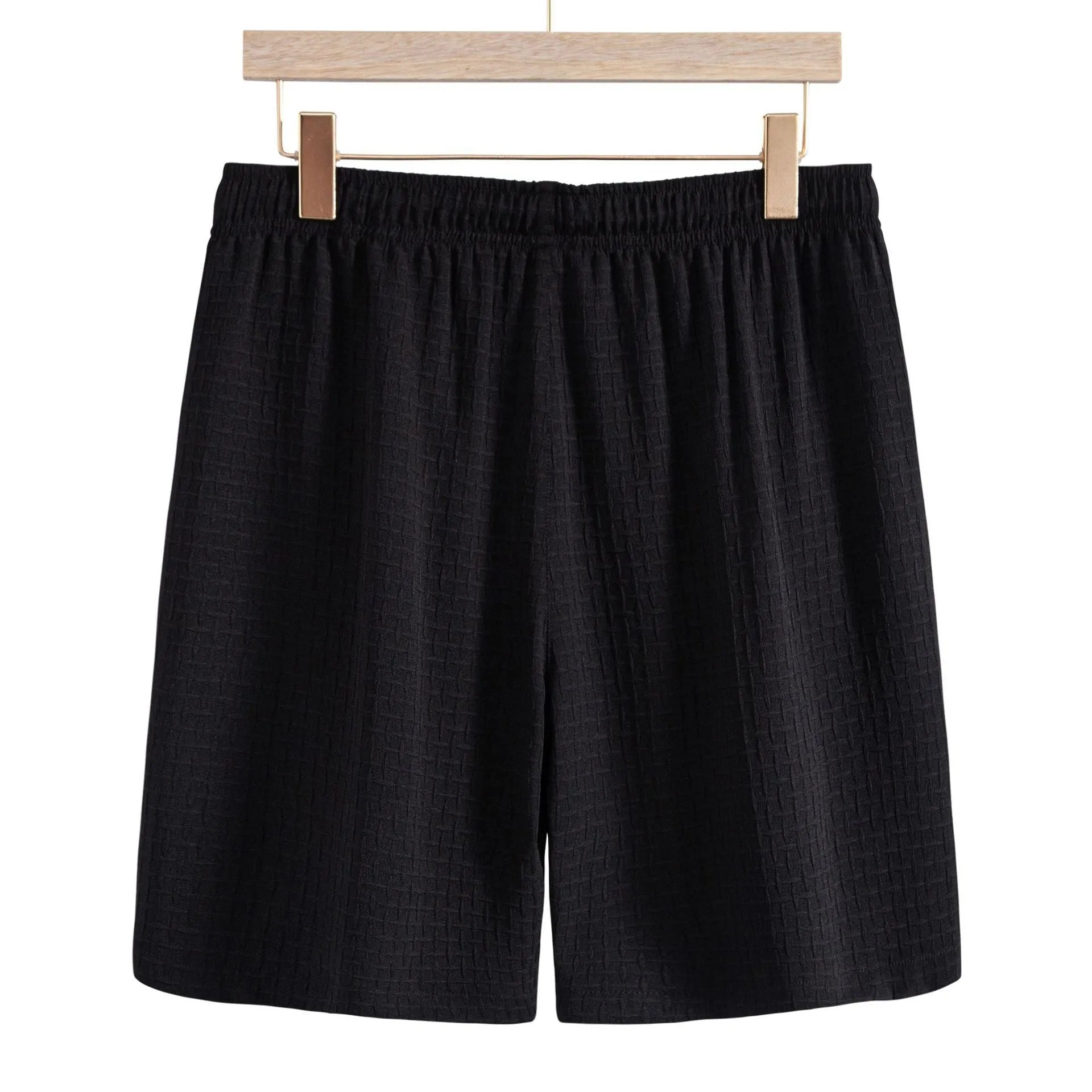 Men's black cotton blend short sleeve shirt and shorts suit set on a hanger.