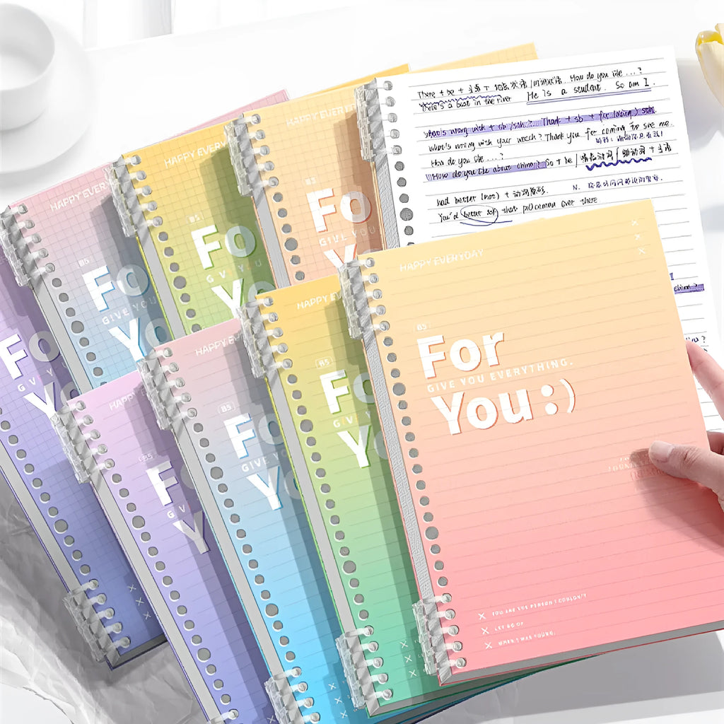 Removable coil gradient notebook in A4 size with blue cover, open to show wood-free paper pages.