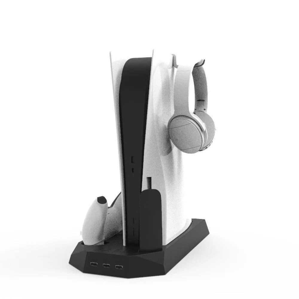 White PS5 charging base and radiator stand dock with headphone hook next to a PlayStation 5 console.