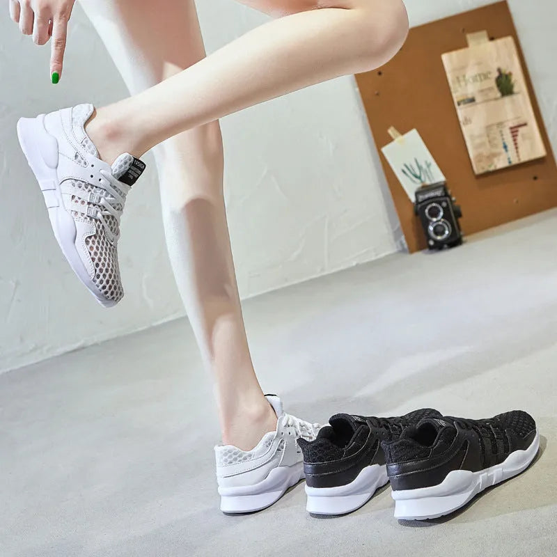 Breathable mesh casual sneakers with hollow-out design and round toe in black and white colour options