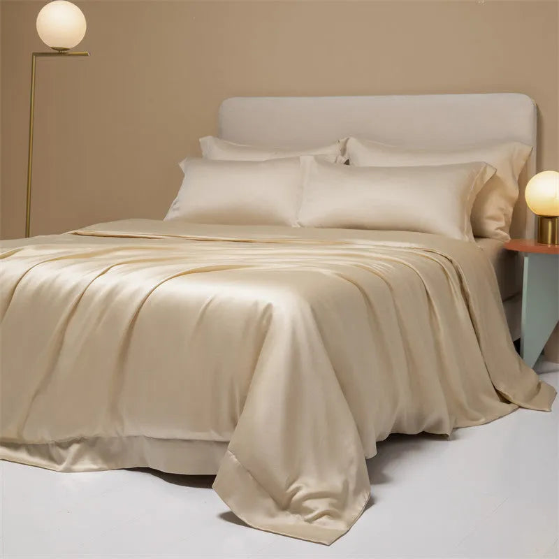 200 thread count Lenzing Tencel quilt cover and sheet set in Aurora Blue, laid on a bed.
