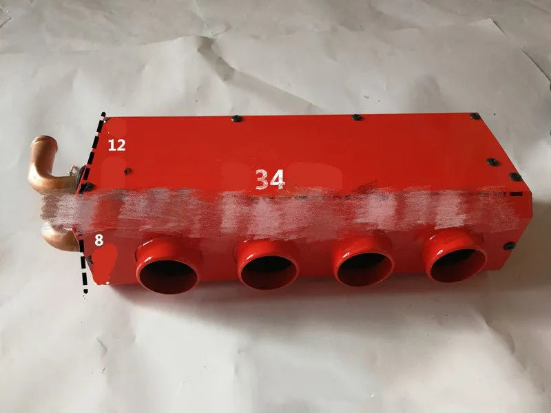 Compact metal car heater with copper pipe connections for 12V or 24V vehicle installation.