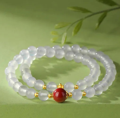 White double layer agate bracelet with 6mm geometry-shaped beads on a wrist