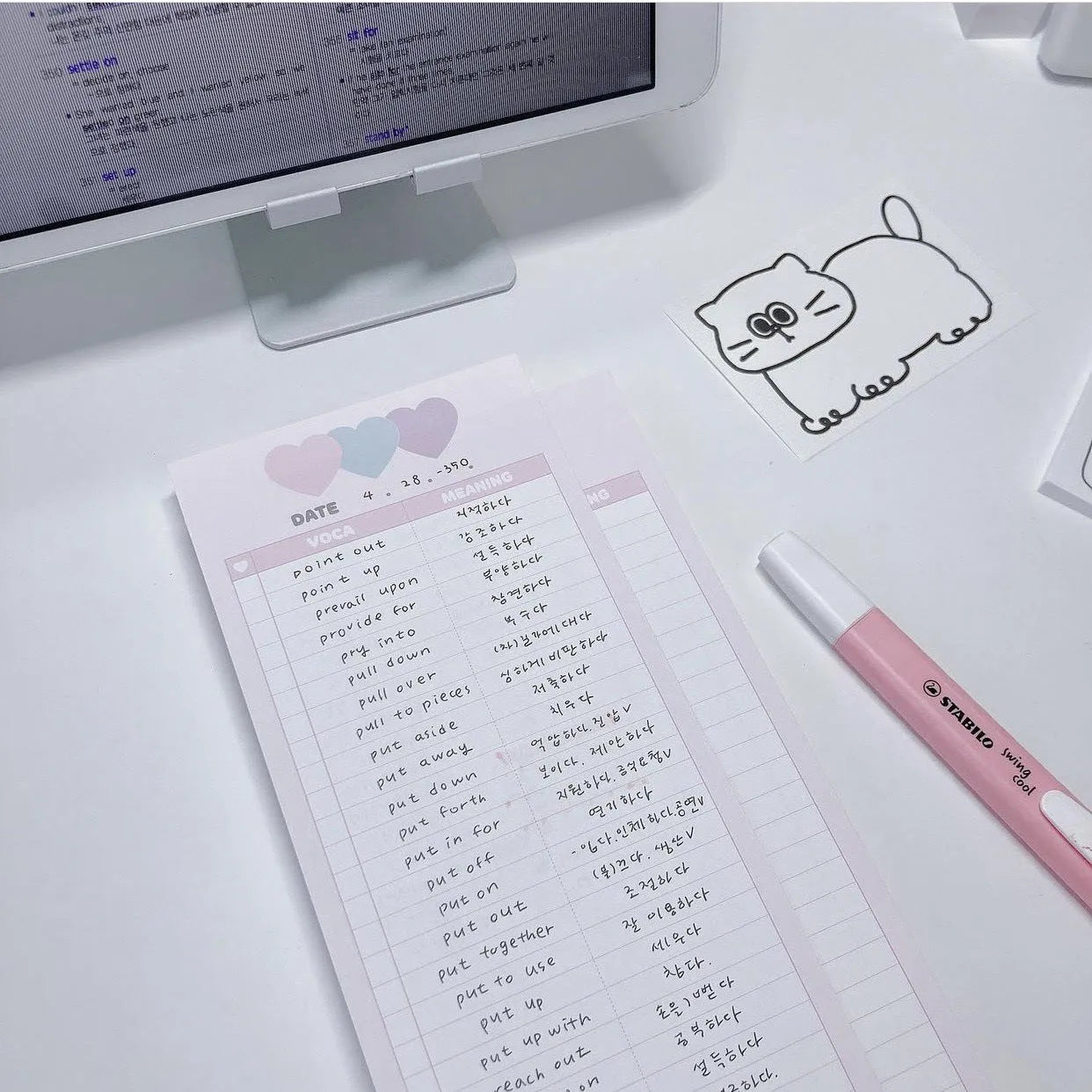 Half-B5 size notepad with English words, shown in pink, purple, and blue cover colour options.